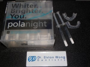 A typical overnight whitening kit that we employ. At right are custom-fitted trays that hold the whitening gel against the teeth and prevent exposure to the surrounding tissues. The patient expresses a small amount of gel into the tray, and then the tray is seated onto the teeth.