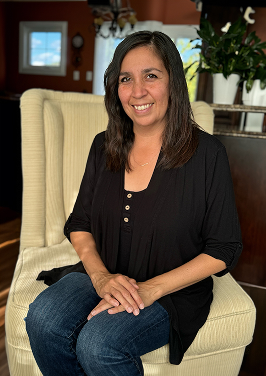 Female staff member smiling indoors