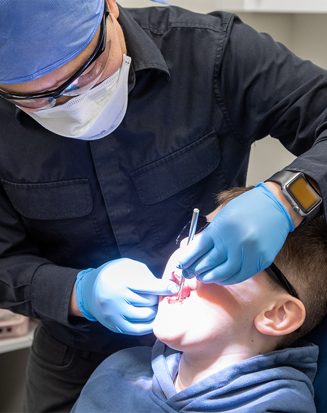 Dentist performing treatment on patient