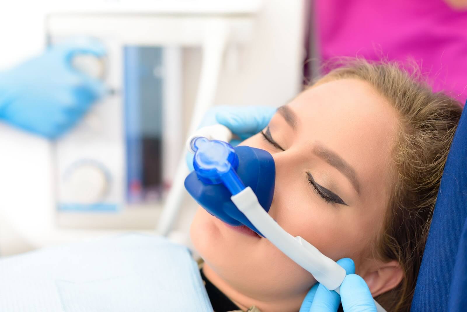 a woman getting sedated at the dentist