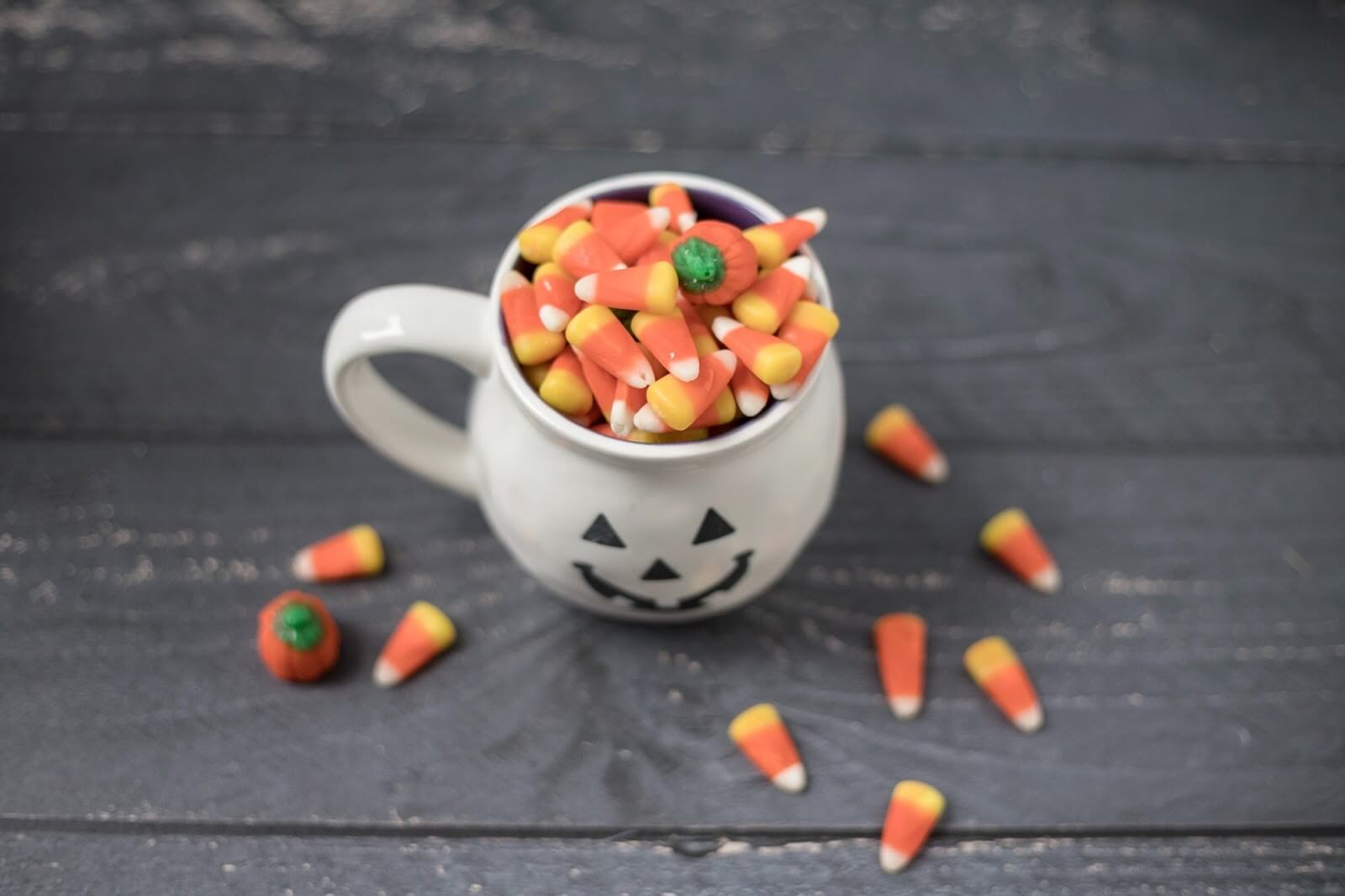 a mug full of halloween candy